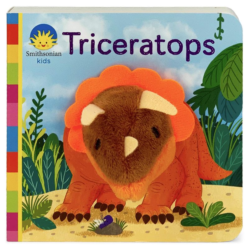 Let’s play with our Triceratops friend! Learn all about the horned dinosaur that roamed the marshes and forests of North America more than 65 million years ago. This story features a fun finger puppet toy built into the board book encouraging interactive play, hand-eye coordination, sensory and language development. Babies and toddlers learn best when they are playing, especially when their grown-ups are in on the fun! A perfect dinosaur introduction for littles packed with fun dino facts. Smithsonian Kids books feature engaging educational content for little learners that reflect the integrity of the Smithsonian. A portion of the proceeds from the sale of this book goes to support the Smithsonian's educational mission. Collect the entire series in the Finger Puppet Collection! Story entertains while teaching language patterns to babies and toddlers Dinosaur puppet encourages interactive play between little ones and their grown-ups Soft plush and story combine to provide both tactile and verbal learning opportunities Practice hand-eye coordination while enjoying together time Great gift for the little dinosaur fan in your life! Officially licensed Smithsonian Kids product